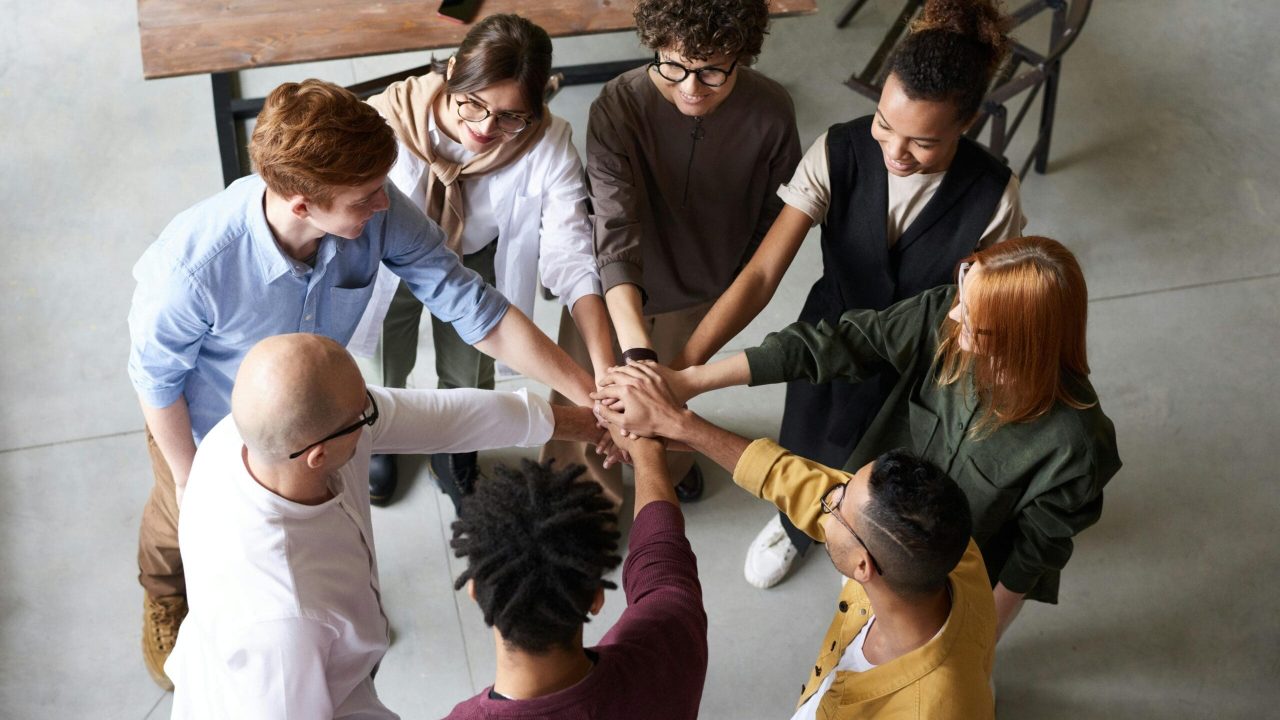 Top view of diverse group of people collaborating in office setting.